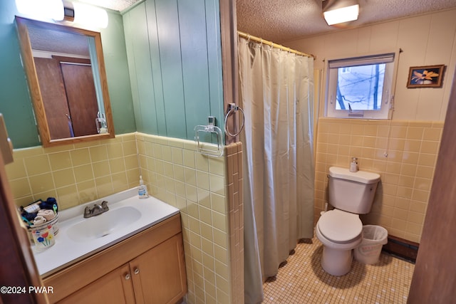 150 N Lake Dr, Dingmans Ferry, PA 18328 - bathroom with tile walls, a textured ceiling, vanity, tile patterned floors, and a shower with shower curtain