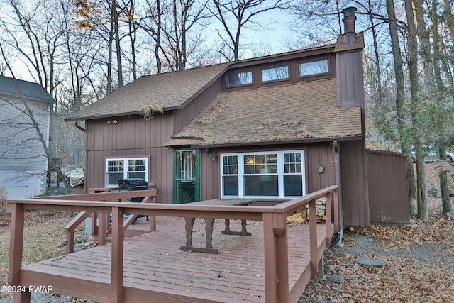 150 N Lake Dr, Dingmans Ferry, PA 18328 - rear view of property with roof with shingles, a deck, and a chimney