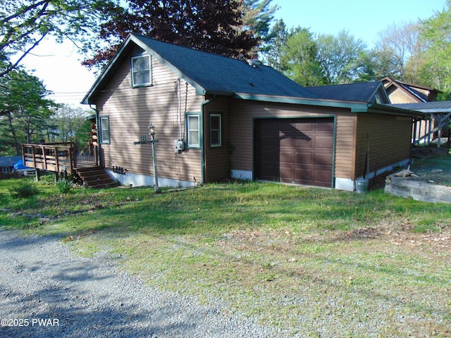 105 Leonard Ln, Paupack, PA 18451 - view of side of home with an attached garage, driveway, a deck, and a yard