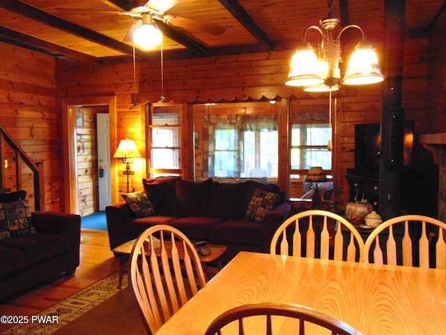 105 Leonard Ln, Paupack, PA 18451 - dining space featuring beam ceiling, a ceiling fan, wood finished floors, stairs, and wooden ceiling