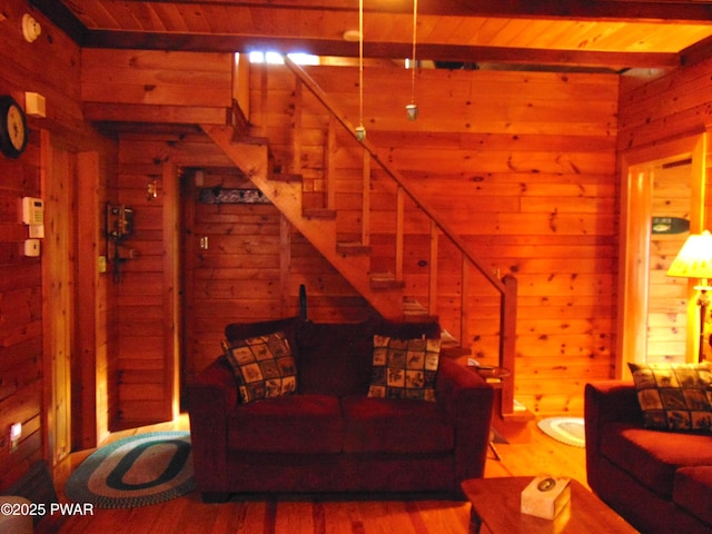 105 Leonard Ln, Paupack, PA 18451 - living room featuring wooden walls, stairs, wood finished floors, wood ceiling, and beam ceiling