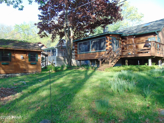 105 Leonard Ln, Paupack, PA 18451 - rear view of house featuring a sunroom, log siding, stairs, a deck, and a yard