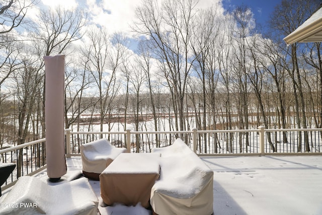 view of snow covered deck