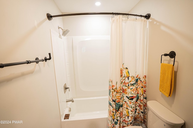 bathroom with shower / tub combo and toilet