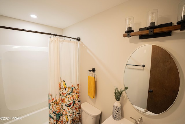 bathroom featuring toilet and shower / tub combo with curtain