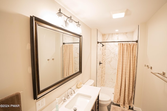 bathroom featuring toilet, vanity, and a shower with shower curtain