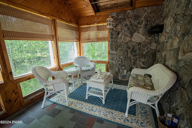 sunroom featuring wooden ceiling and lofted ceiling