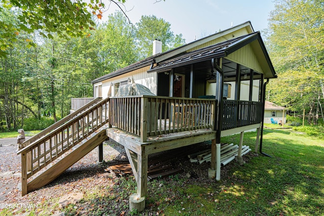 wooden deck featuring a yard