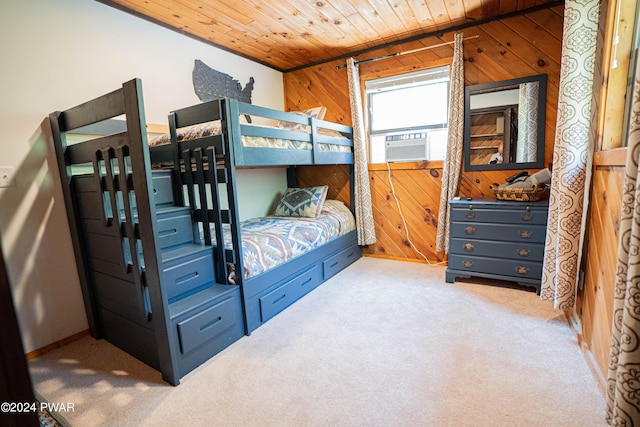 bedroom featuring cooling unit, light colored carpet, wooden ceiling, and wooden walls