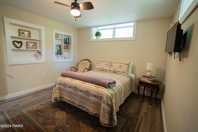 bedroom featuring ceiling fan and dark hardwood / wood-style floors