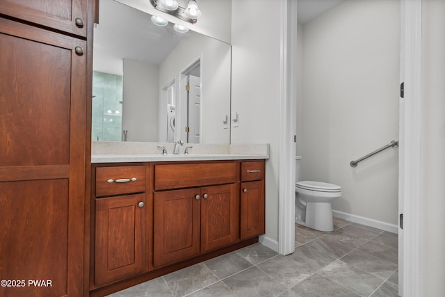 309 Braeburn Path, Matamoras, PA 18336 - bathroom featuring vanity, toilet, baseboards, tile patterned floors, and a tile shower
