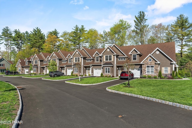 309 Braeburn Path, Matamoras, PA 18336 - townhome / multi-family property with a residential view, stone siding, a garage, a front yard, and driveway