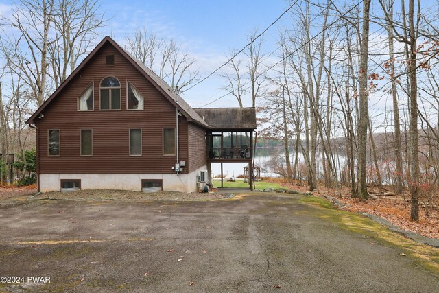 view of home's exterior with a water view