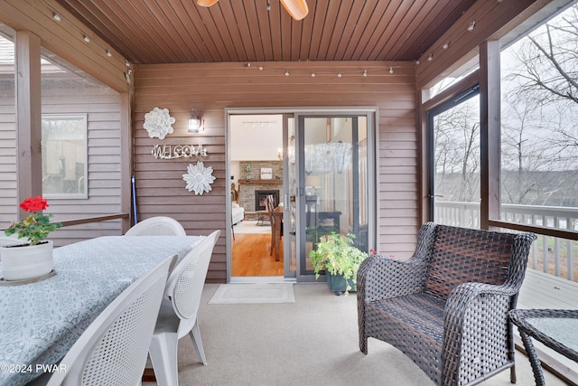 sunroom featuring wooden ceiling