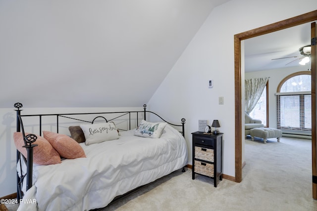 carpeted bedroom featuring ceiling fan and vaulted ceiling