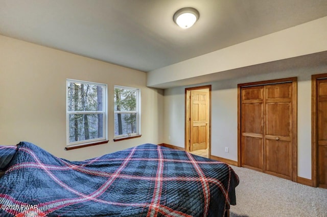 carpeted bedroom with baseboards