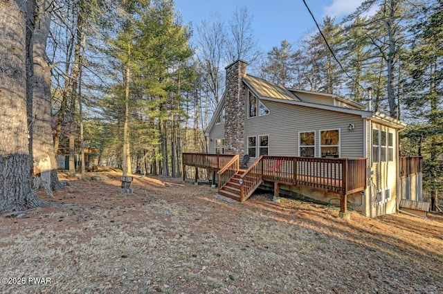 exterior space featuring a deck and a chimney