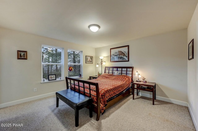 carpeted bedroom featuring baseboards