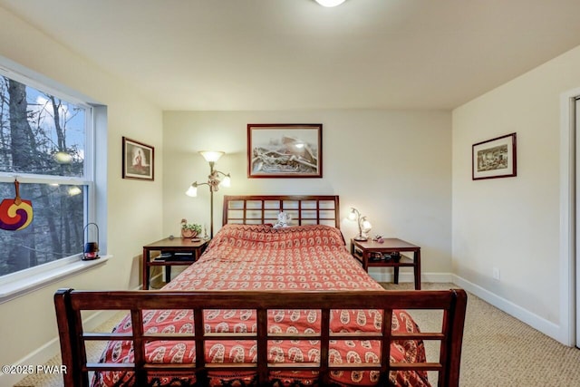 bedroom with carpet and baseboards