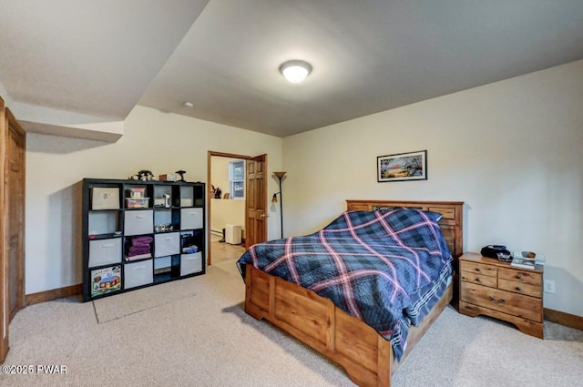 carpeted bedroom featuring baseboards