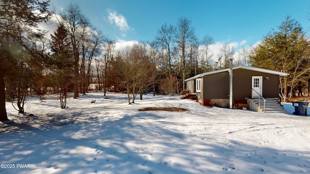 view of yard layered in snow