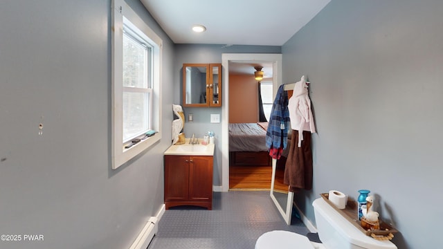 interior space featuring baseboards and a sink