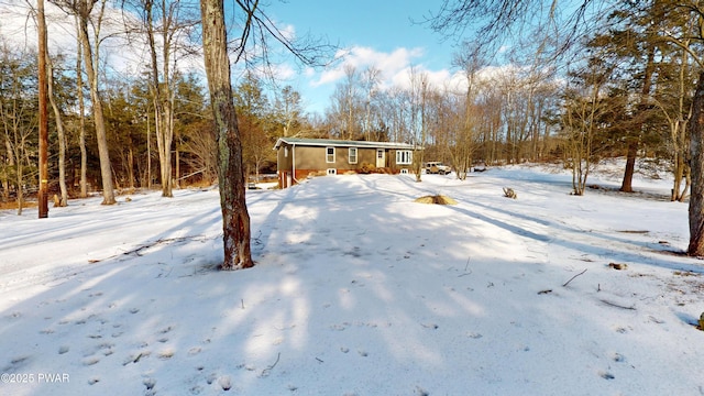 view of yard layered in snow