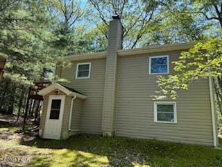 195 Conashaugh Trl, Milford, PA 18337 - rear view of house with a chimney