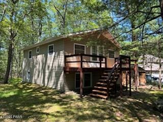 195 Conashaugh Trl, Milford, PA 18337 - back of property with a deck and stairway