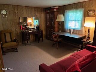 195 Conashaugh Trl, Milford, PA 18337 - carpeted living room with wood walls