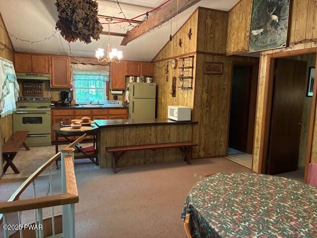 195 Conashaugh Trl, Milford, PA 18337 - kitchen featuring white appliances, lofted ceiling, wooden walls, a chandelier, and brown cabinetry