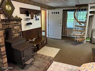195 Conashaugh Trl, Milford, PA 18337 - living area featuring a wood stove, carpet floors, and stairway