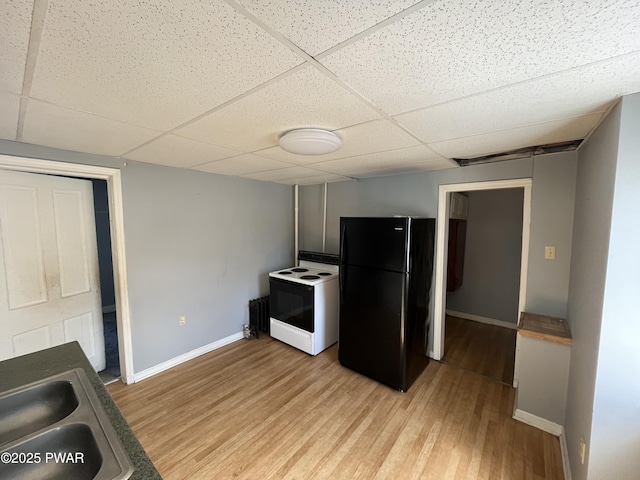 1021 Fellows St, Scranton, PA 18504 - kitchen with freestanding refrigerator, a drop ceiling, electric range, and light wood-style flooring