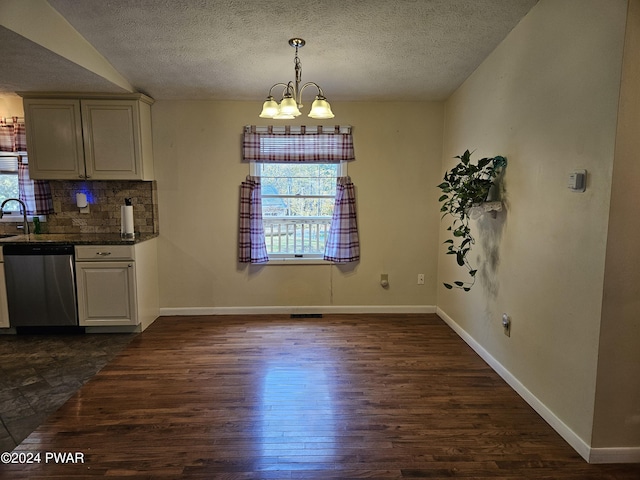 unfurnished dining area with dark wood-type flooring and a chandelier