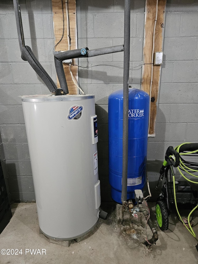 utility room with electric water heater