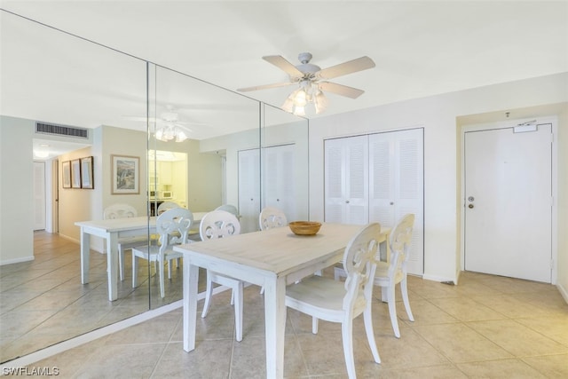 dining area with light tile floors and ceiling fan