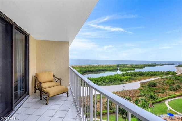 balcony featuring a water view