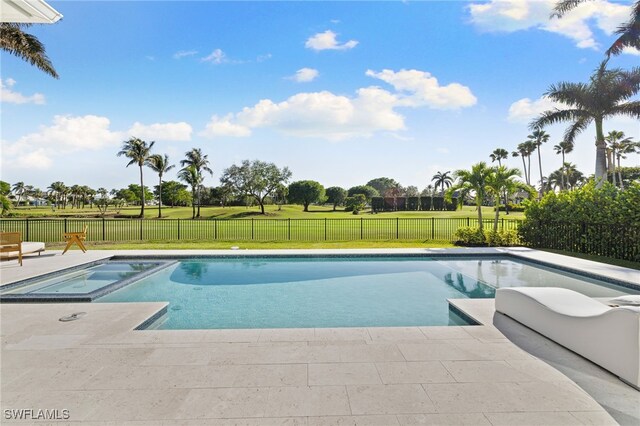 view of swimming pool with a yard, a patio, a fenced backyard, and a pool with connected hot tub