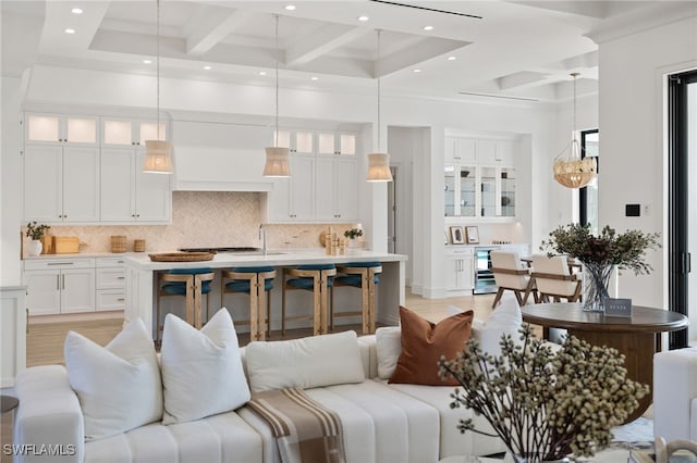 interior space with a towering ceiling, coffered ceiling, and beam ceiling