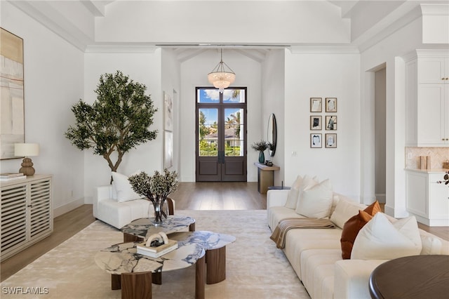 living area with light wood-style floors and baseboards