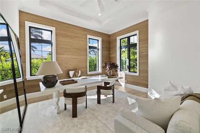 sitting room featuring light wood-style flooring, recessed lighting, a ceiling fan, baseboards, and a tray ceiling