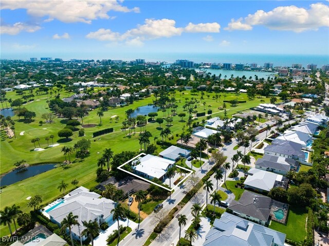 aerial view featuring view of golf course and a water view