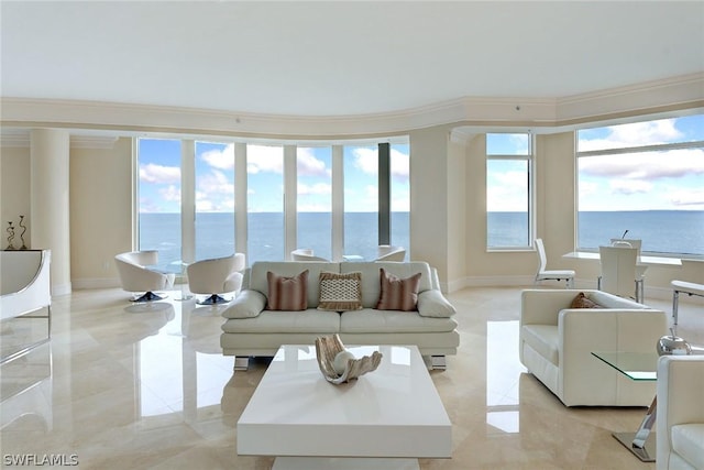 living area featuring marble finish floor, a water view, crown molding, and baseboards