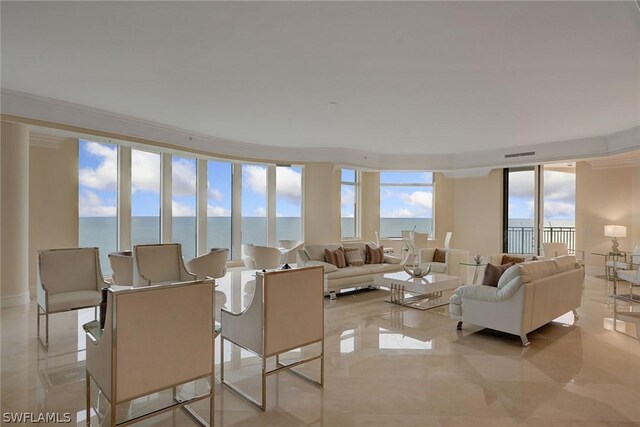 living room with light tile patterned flooring, a wall of windows, a water view, and crown molding