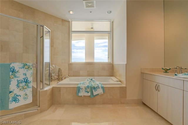 bathroom featuring a stall shower, visible vents, tile patterned flooring, vanity, and a bath