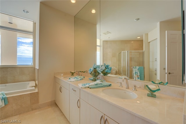 bathroom featuring separate shower and tub, tile patterned flooring, and double sink vanity