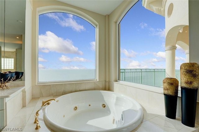 full bathroom with a water view and a tub with jets