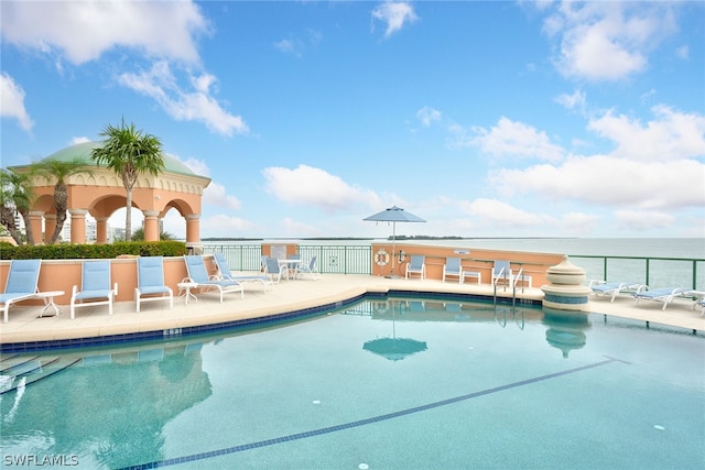 view of swimming pool with a patio