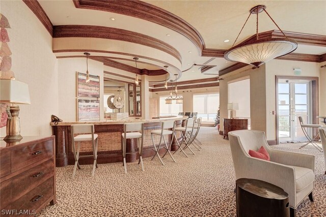 carpeted dining space featuring ornamental molding