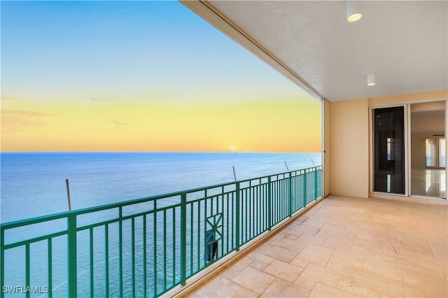 balcony featuring a water view